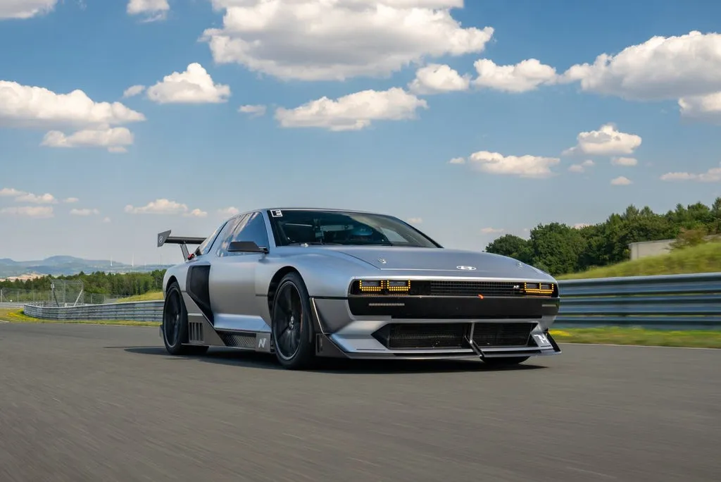 A front view of the Hyundai N Vision 74 emphasizing its aggressive styling and retro-futuristic design