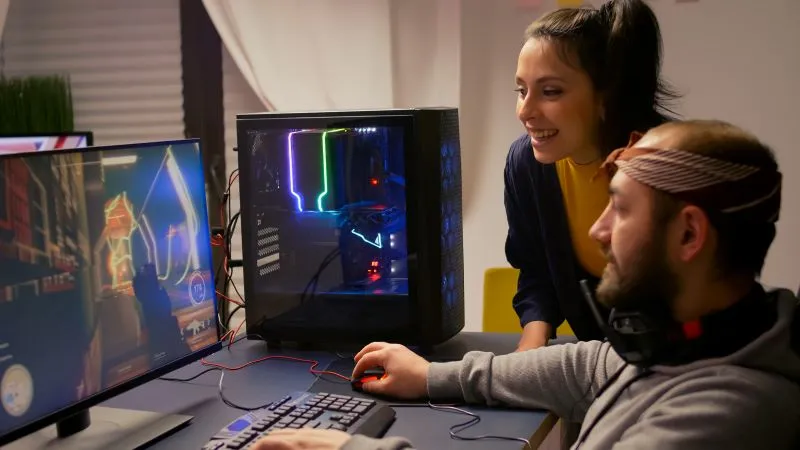 A gamer intensely focused on their screen, representing the pursuit of optimal gaming performance.