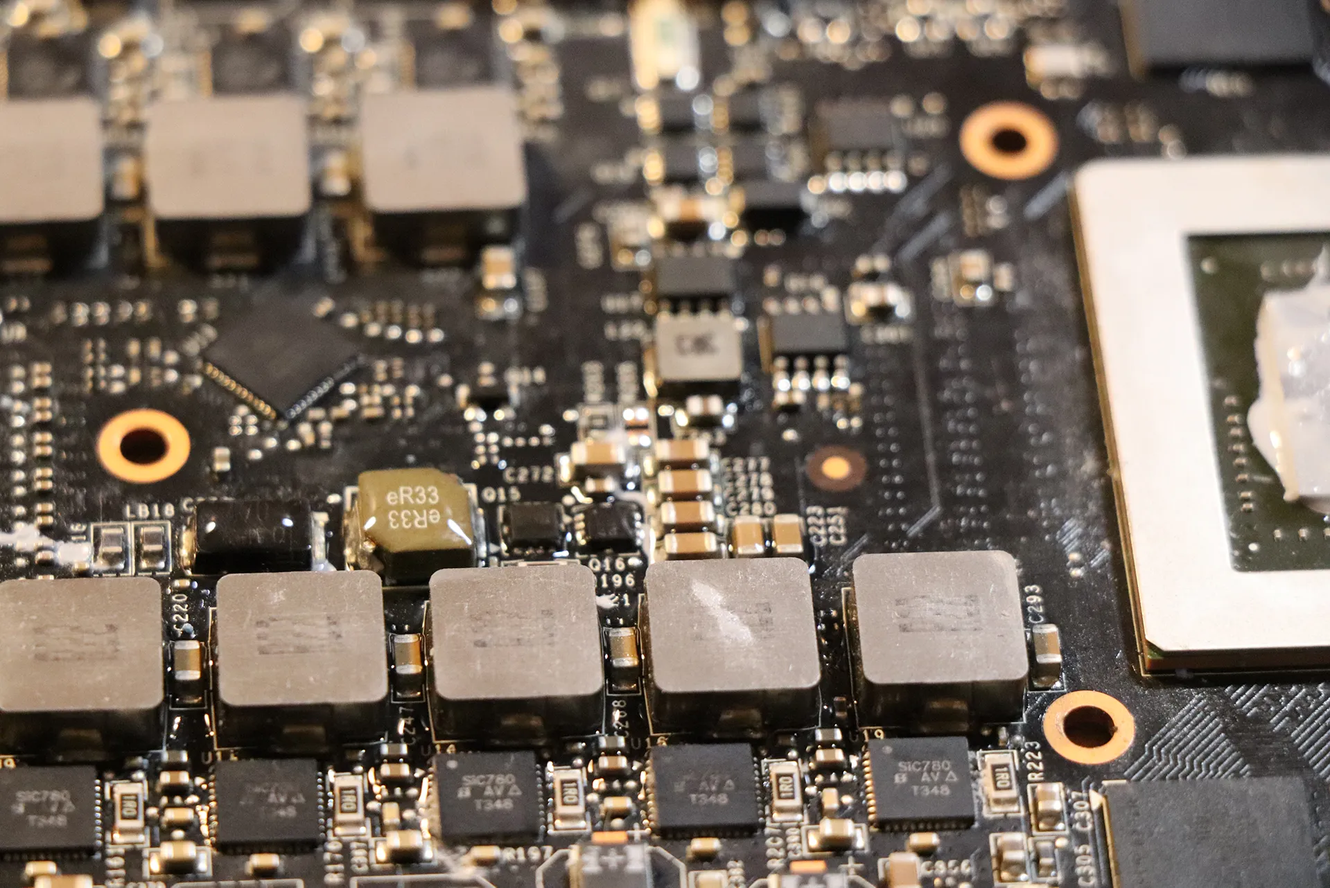 A GTX 690 graphics card with Isopropanol applied to a section of the PCB