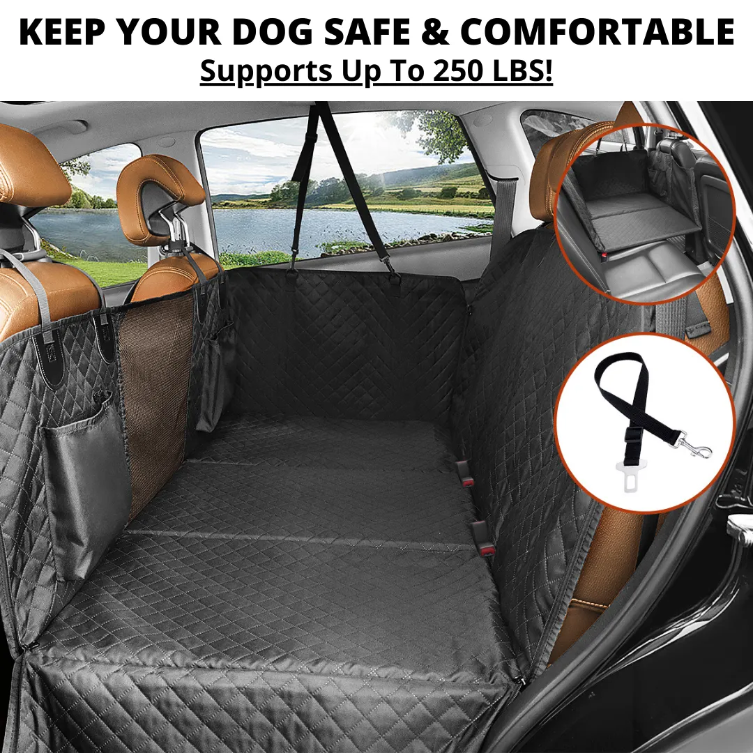 A happy brown dog sitting comfortably and securely in the back seat of a car, protected by a dark-colored Team K9 car seat cover.