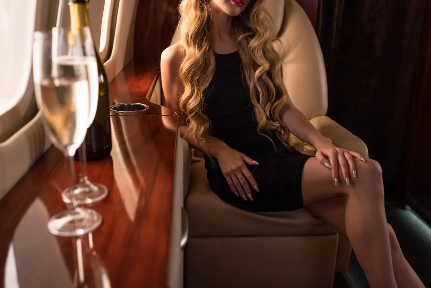 A person enjoying a luxurious dining experience with a lavish spread of food and elegant table setting