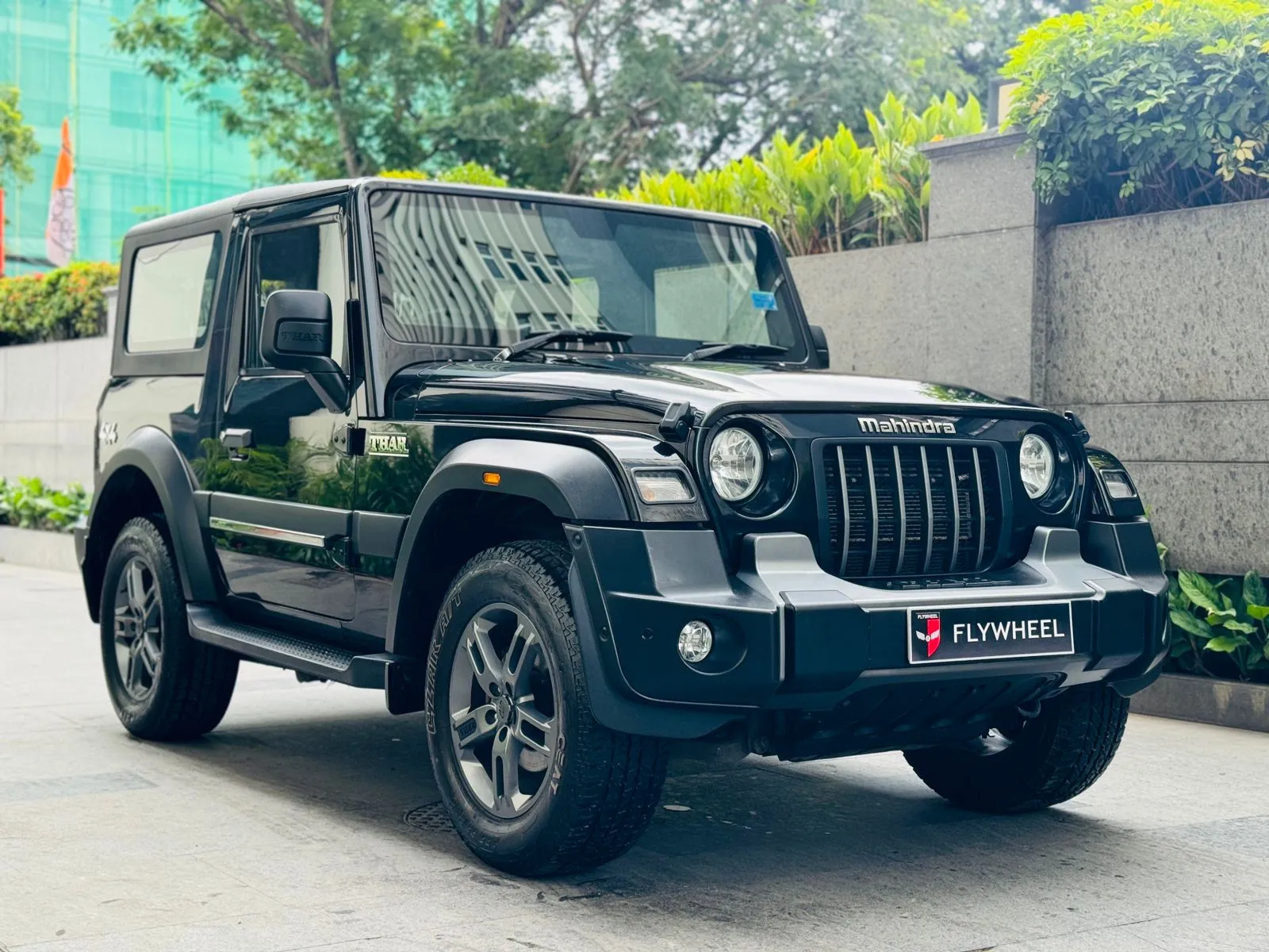 A premium SUV with its doors open, showcasing a spacious and luxurious interior.