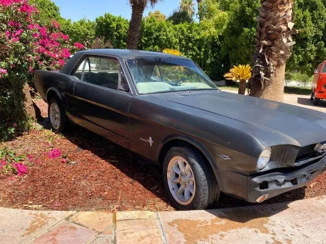 A red 1965 Ford Mustang