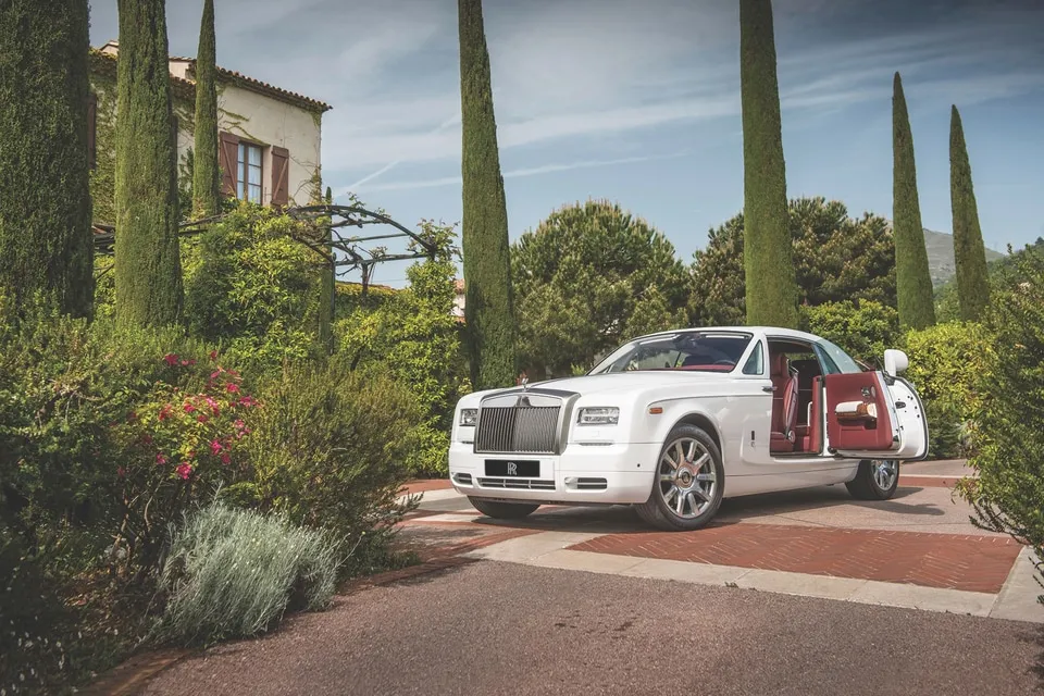 A Rolls-Royce Ghost, showcasing the intricate details of a meticulously crafted luxury sedan interior