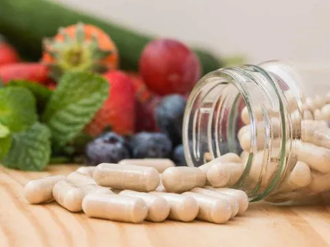 A selection of dog supplements on a table, representing the choice of the right supplement.