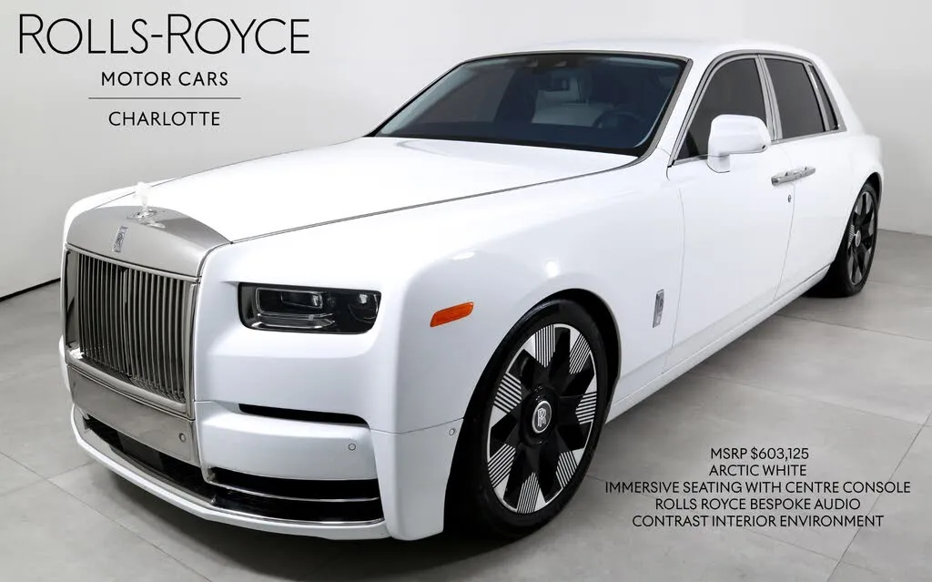 A side view of a sleek, modern Rolls Royce Phantom 8, showcasing its iconic design and long wheelbase.