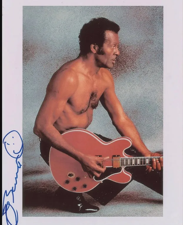 A signed photo of Chuck Berry with a smiley face, from icollector.com.