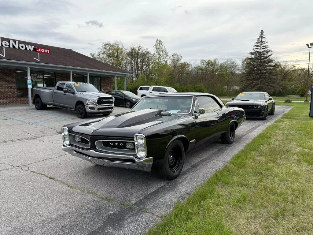 A sleek 1966 Pontiac GTO coupe in Montero Red