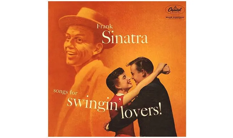 A smiling Frank Sinatra, holding a cigarette and looking relaxed, embodying his iconic persona during the peak of his career.