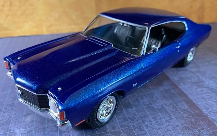 A striking front-three-quarter view of a pristine 1972 Chevrolet Chevelle SS, showcasing its aggressive grille and broad haunches
