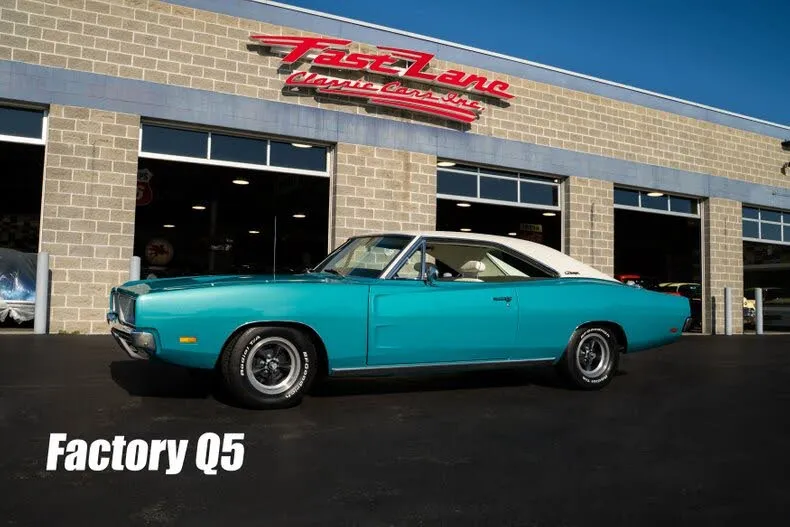 A stunning 1969 Dodge Charger in a bright teal color