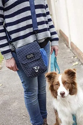 A stylish black DOOG USA Walkie Bag with a shoulder strap, featuring a dedicated poop bag dispenser and space for a water bottle.