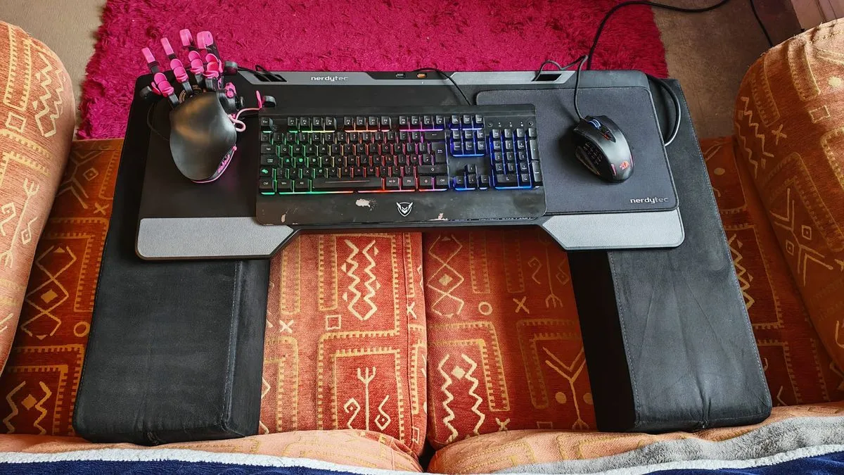 A top-down view of a Couchmaster Cycon 2, showcasing its ergonomic design and spacious surface for peripherals