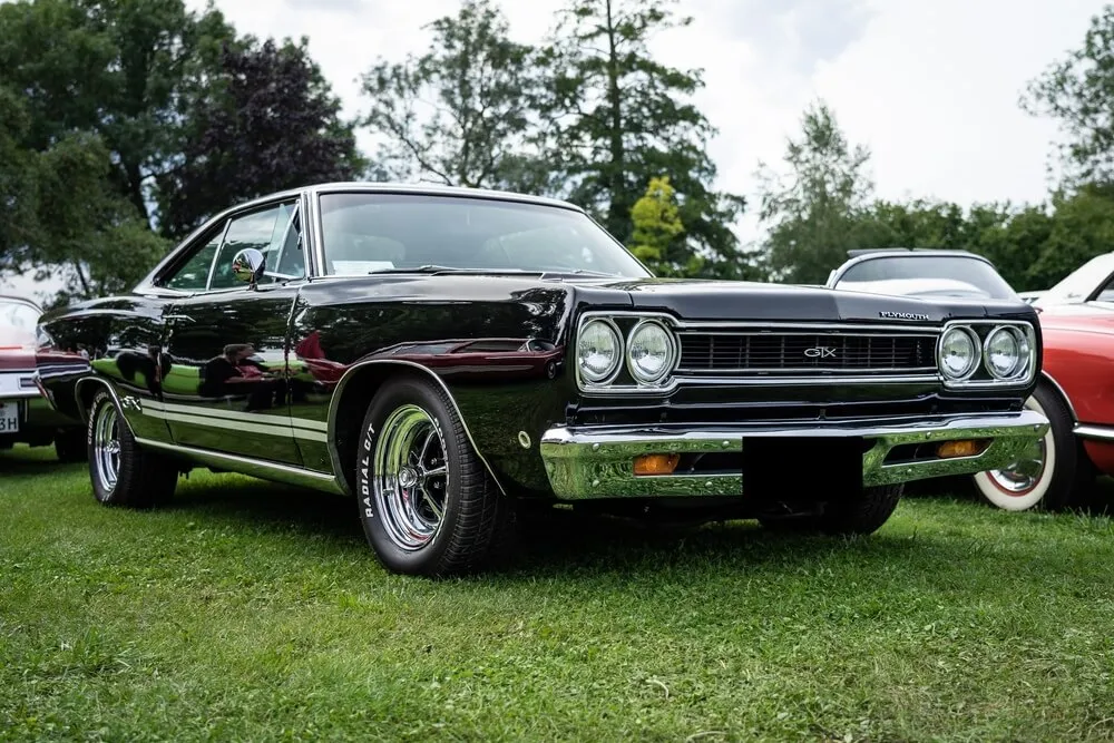 A vibrant exhibition showcasing classic American muscle cars.