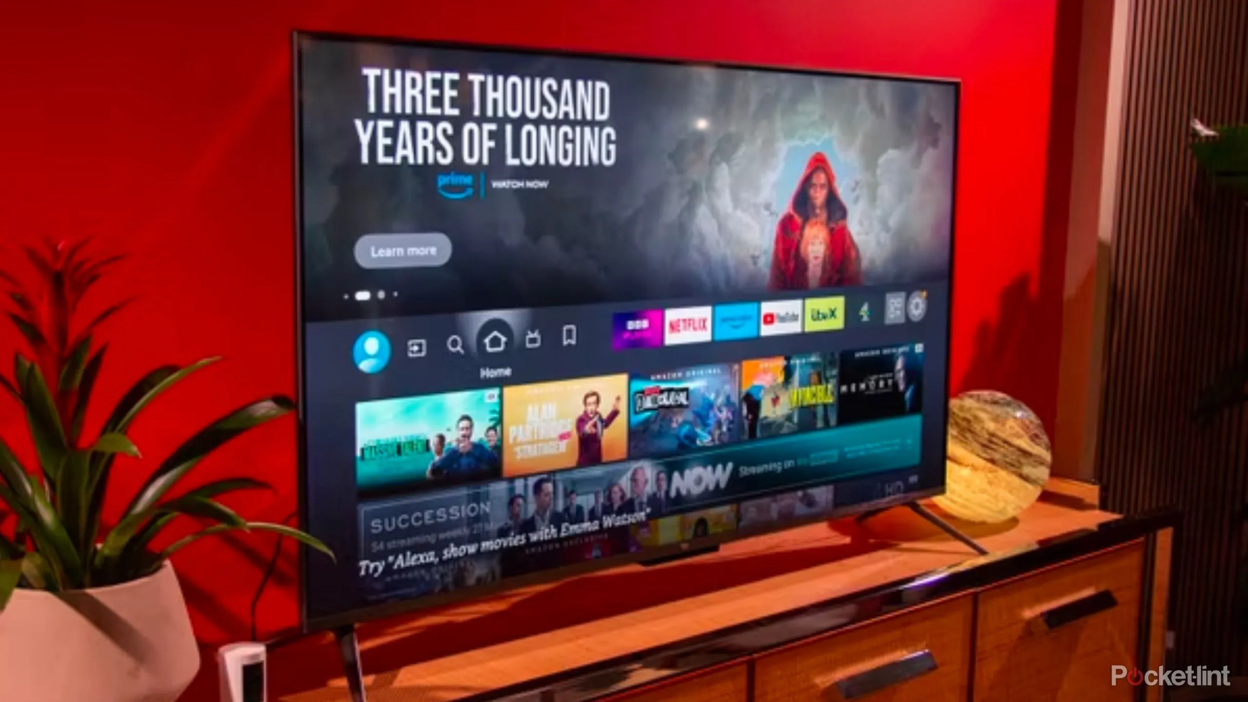 An Amazon Fire TV Omni QLED television displaying content.