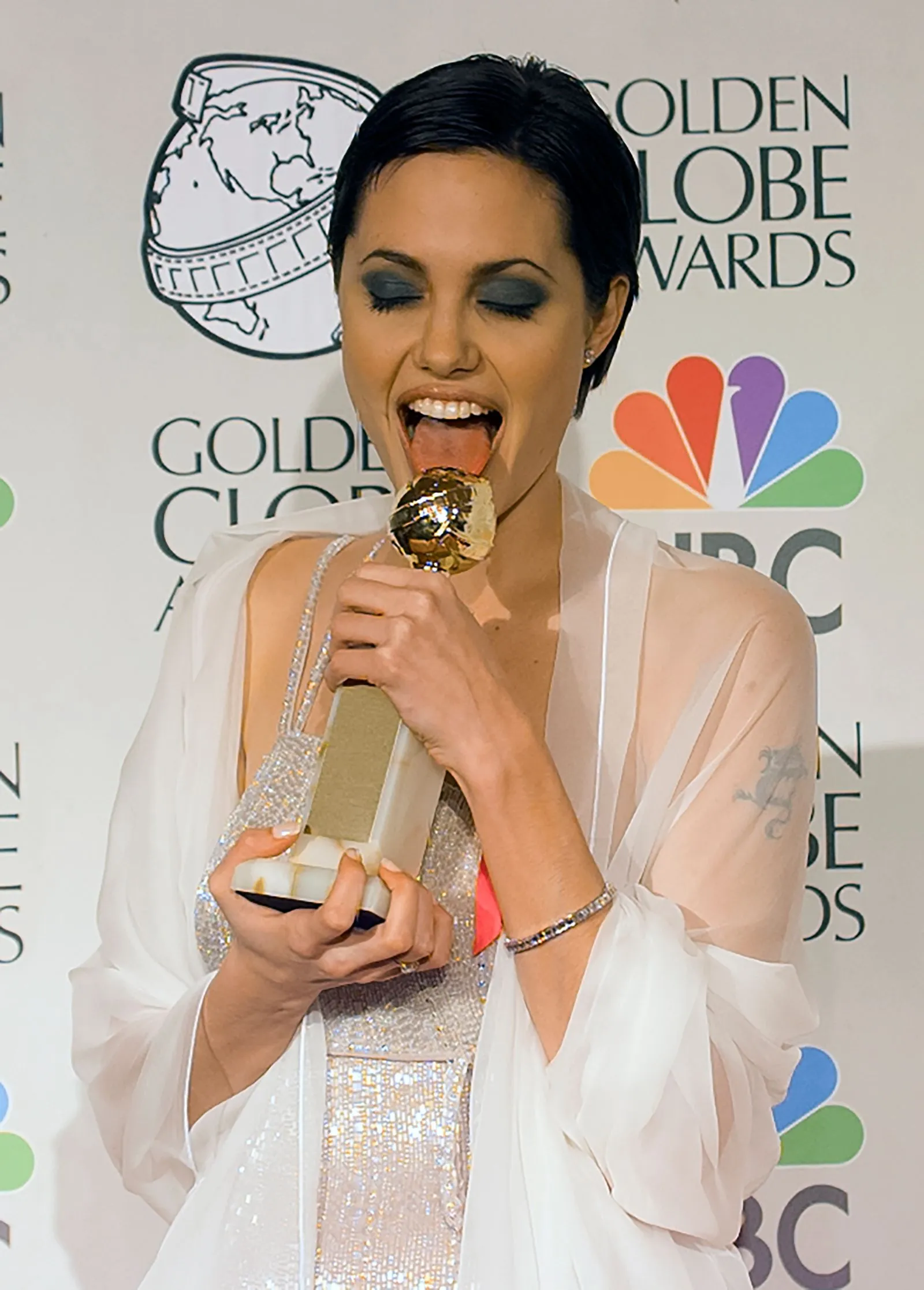 Angelina Jolie wearing striking blue eyeshadow on the red carpet