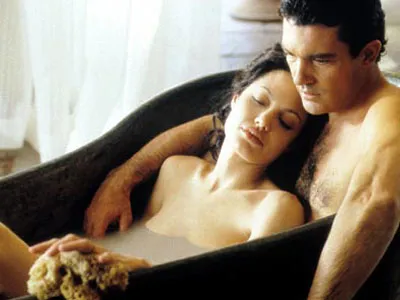 Antonio Banderas and Angelina Jolie sharing a passionate moment in Original Sin