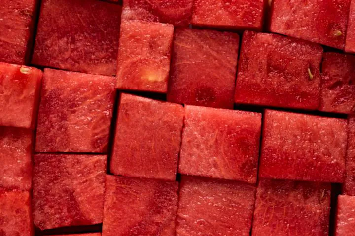 Assortment of cut-up fruits, including watermelon and pineapple