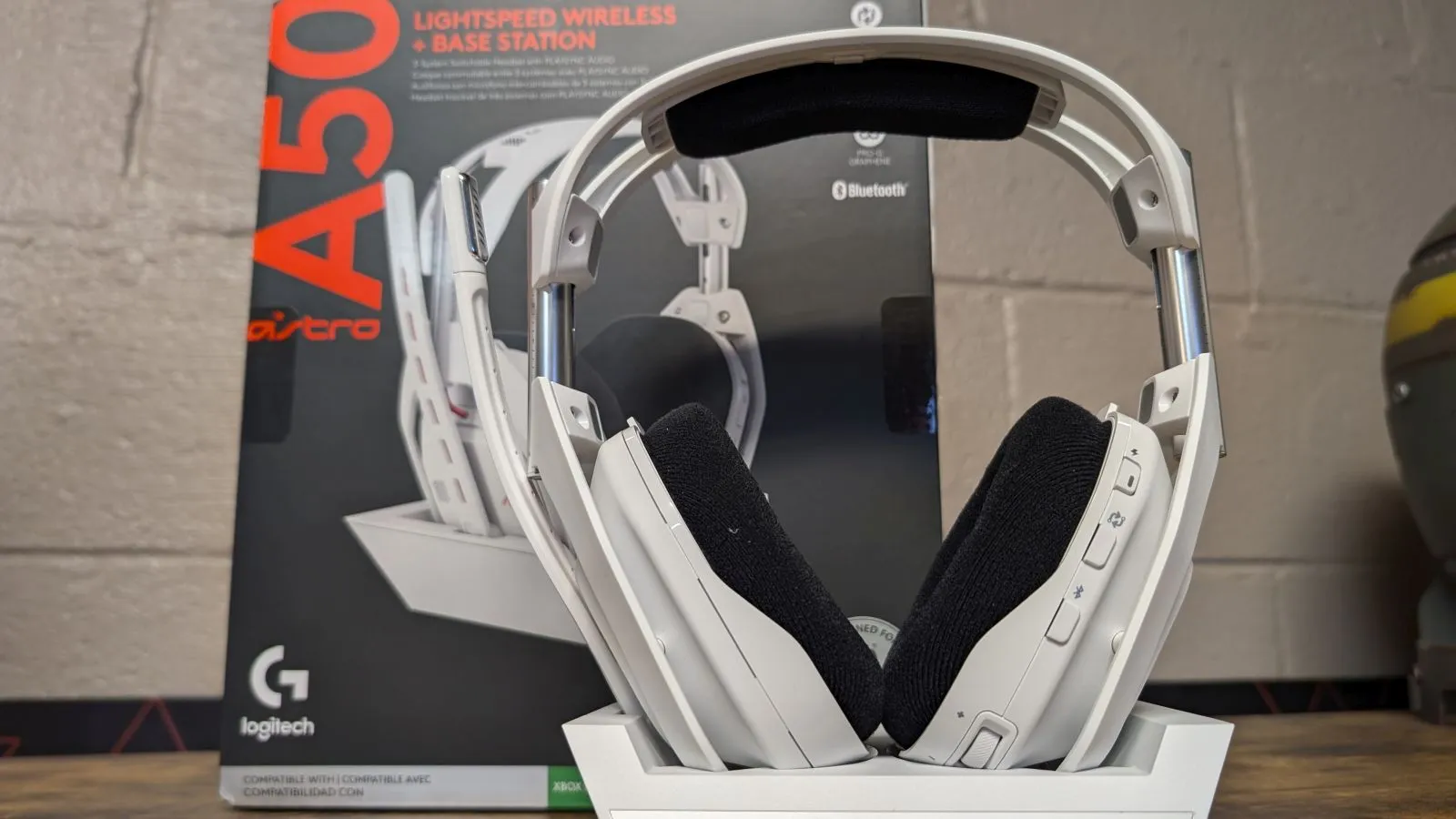 Astro A50 Gen 5 wireless headset positioned on its charging base station.
