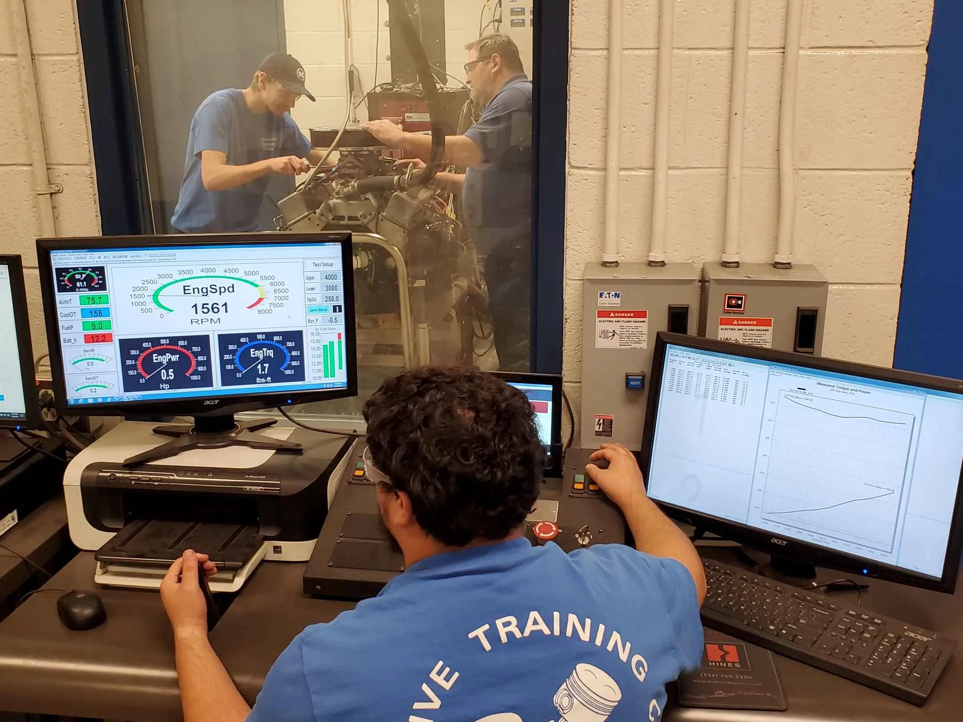 Auto Training Tech Working on an Engine