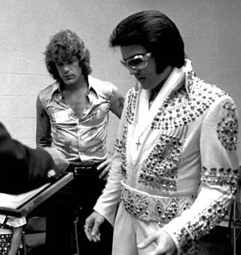 Backstage photograph from 1972 showing Elvis Presley alongside close friend Jerry Schilling.
