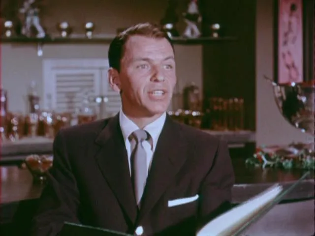 Bing Crosby arriving at Frank Sinatra's Christmas party, exuding casual holiday cheer