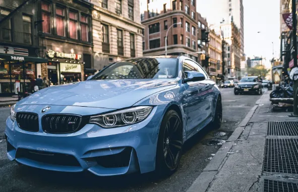 Blue BMW sedan front view