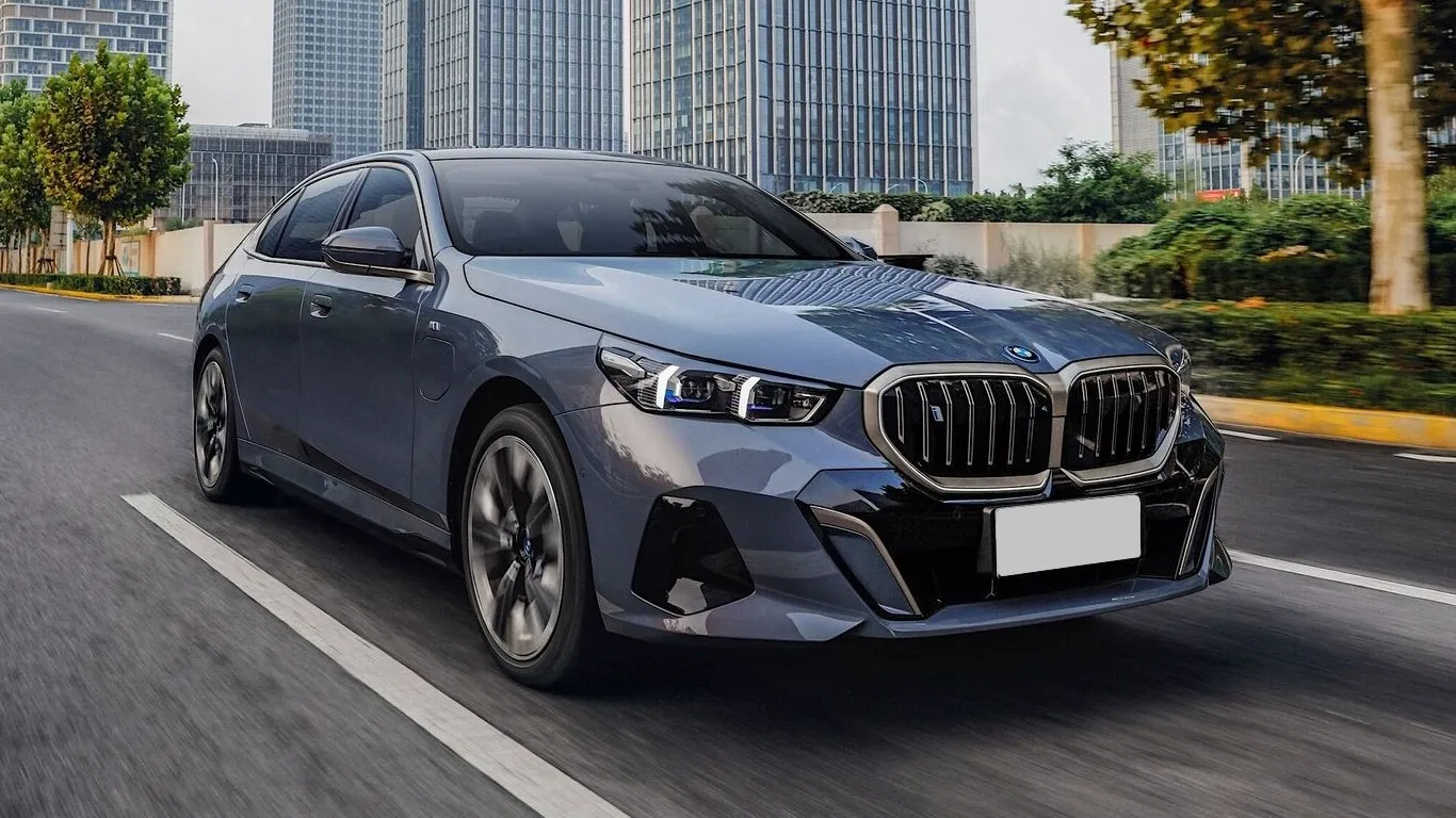 BMW 5 Series on a winding road, demonstrating its sporty yet elegant driving dynamics