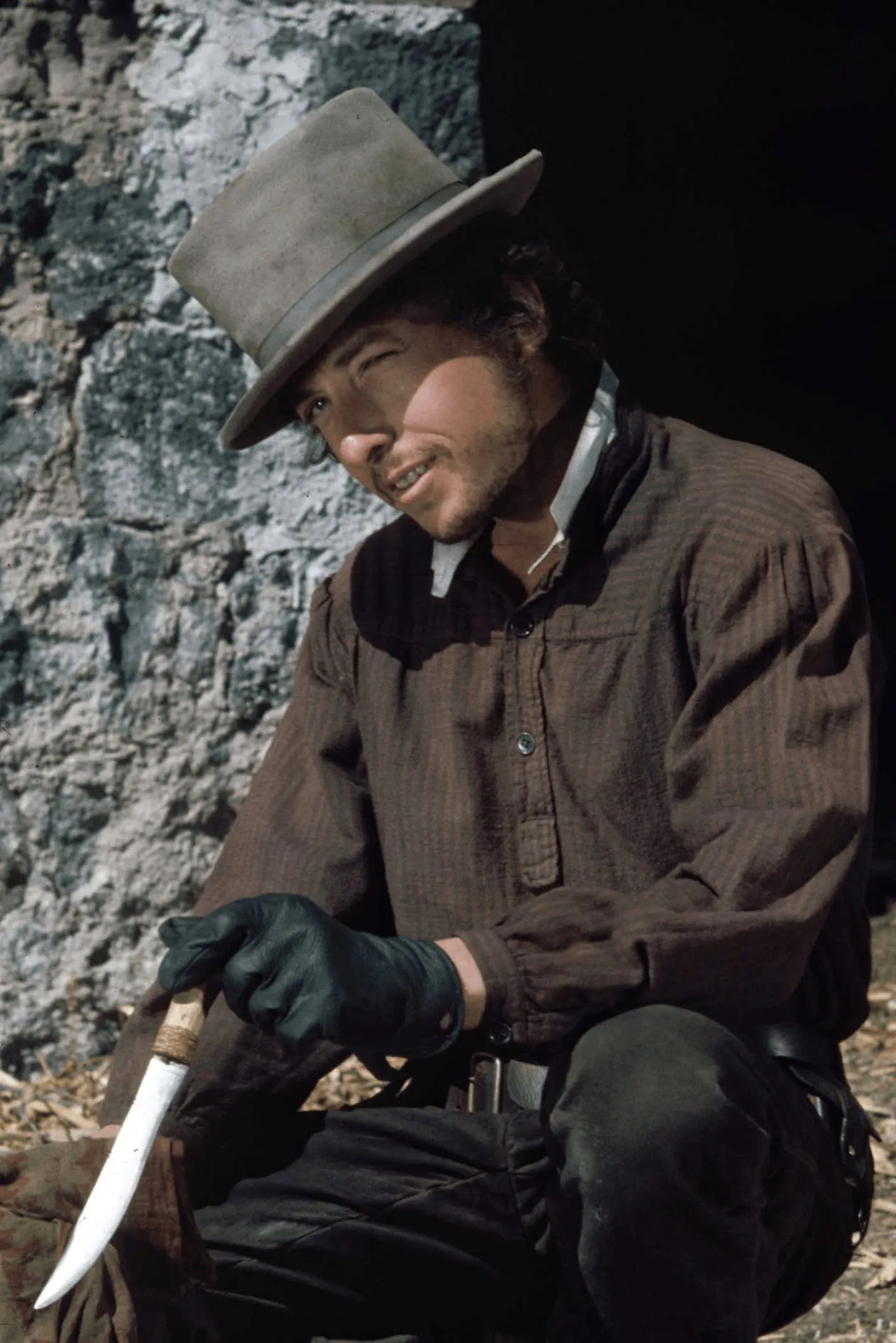 Bob Dylan as 'Alias' in a close-up, depicting his enigmatic persona in Pat Garrett and Billy the Kid.