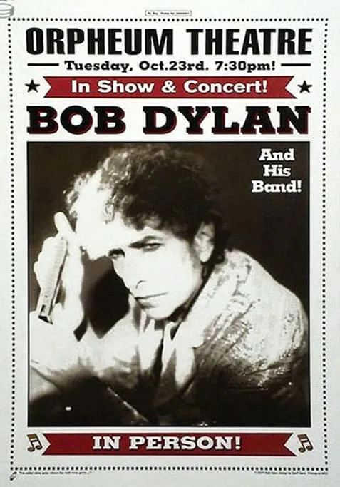 Bob Dylan performing live on stage during his 2001 tour with his signature harmonica and guitar
