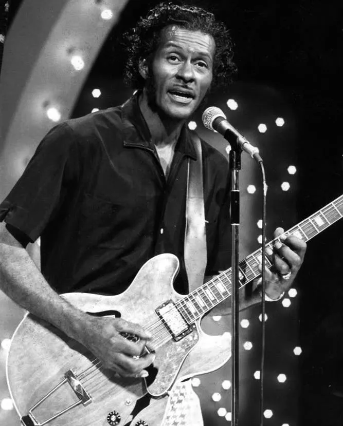 Chuck Berry performing on "The Midnight Special" television program in November 1973, showcasing his dynamic stage presence.
