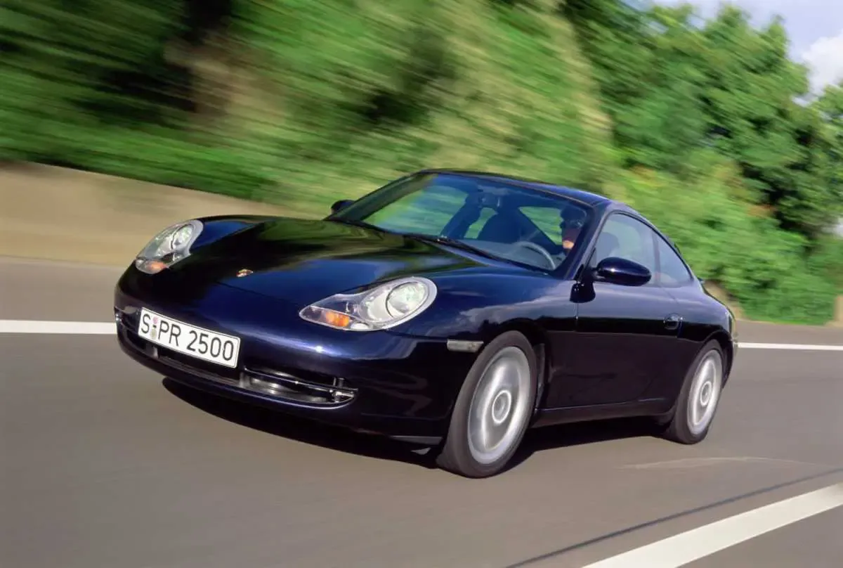 Classic silver Porsche 911 Turbo 996 model parked outdoors