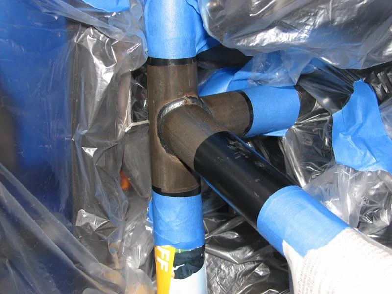 Close-up of masking on a specific joint of the roll cage