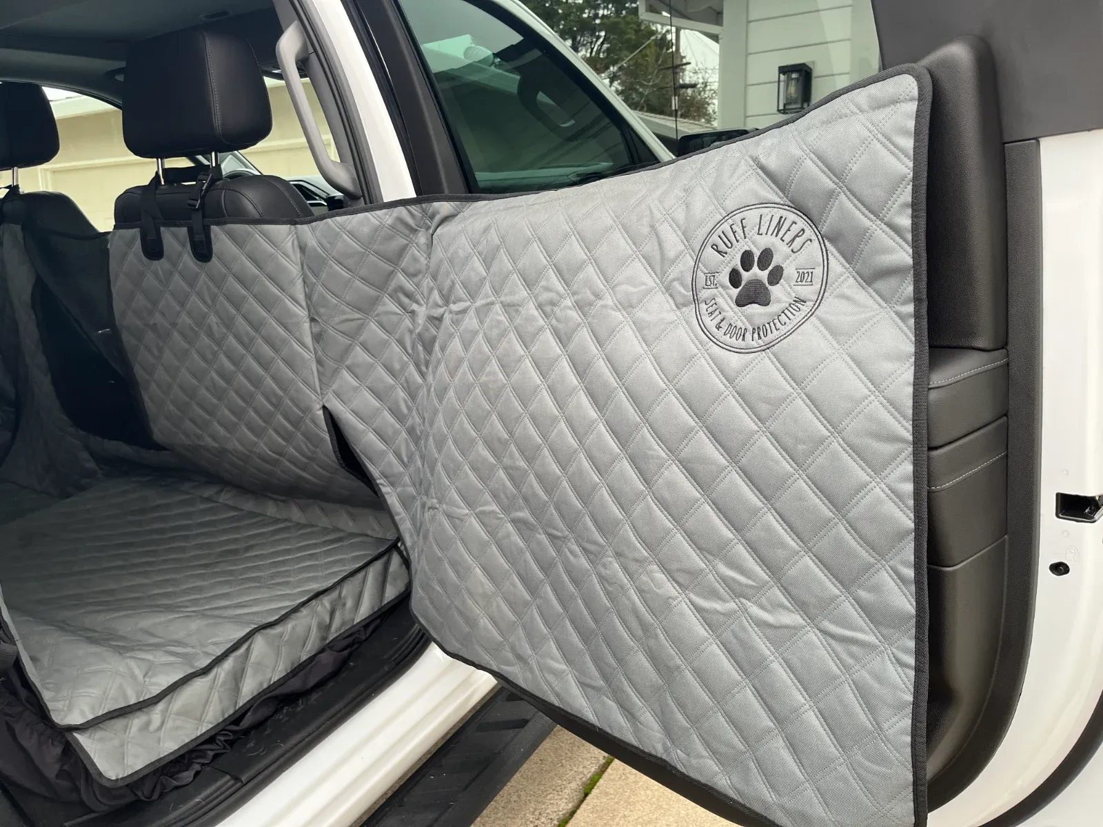 Close-up of Ruff Liners XL showing mesh ventilation and full coverage on door panels