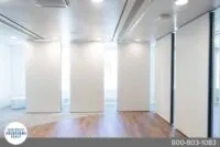 Close-up of sleek operable wall panels in a modern office environment
