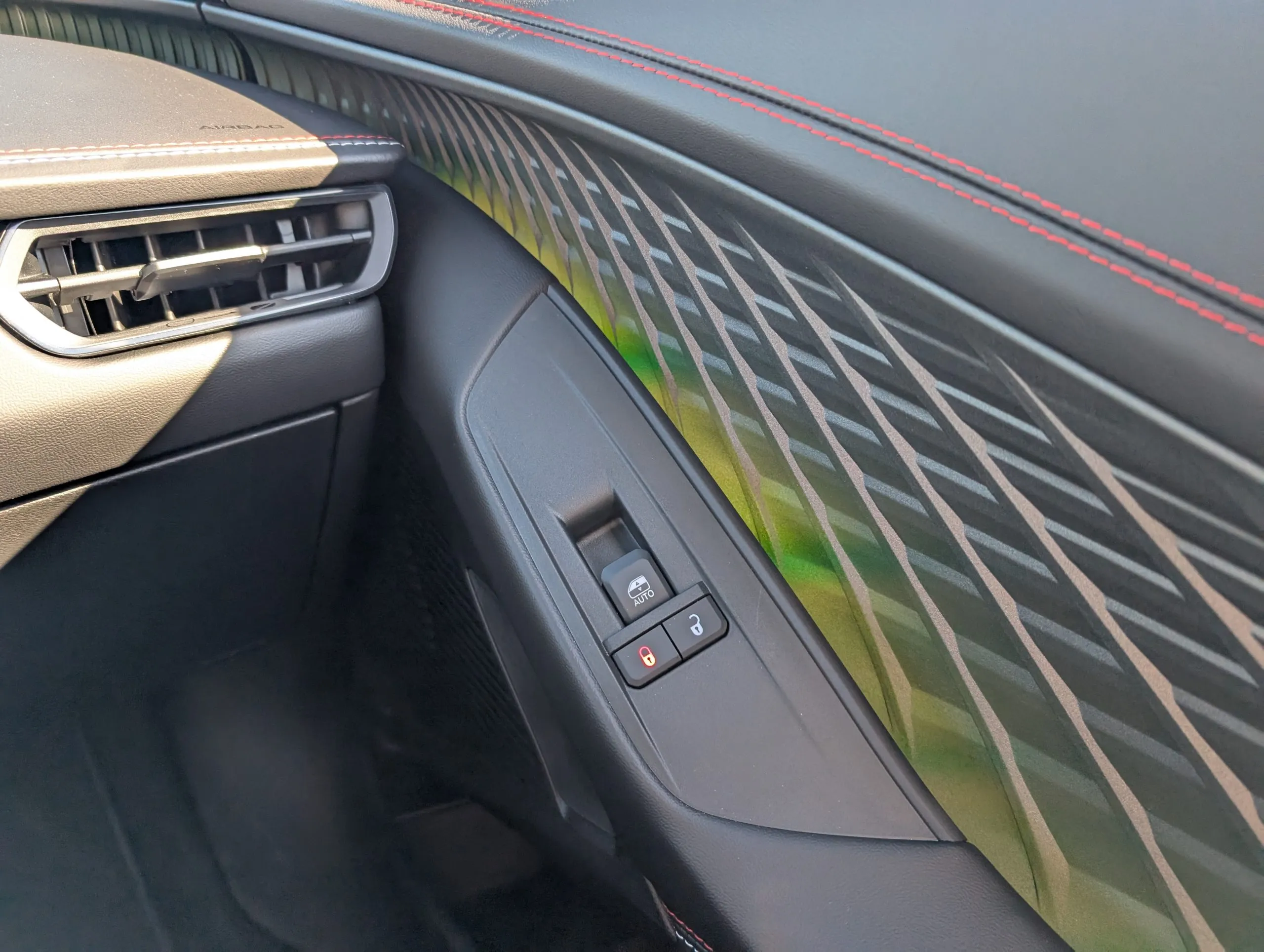 Close-up of the 2024 Dodge Charger Daytona's charging port area, revealing its electric powertrain