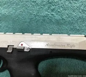Close-up of the Excel Arms MR-22 Accelerator rifle showing its synthetic stock and magazine in the grip