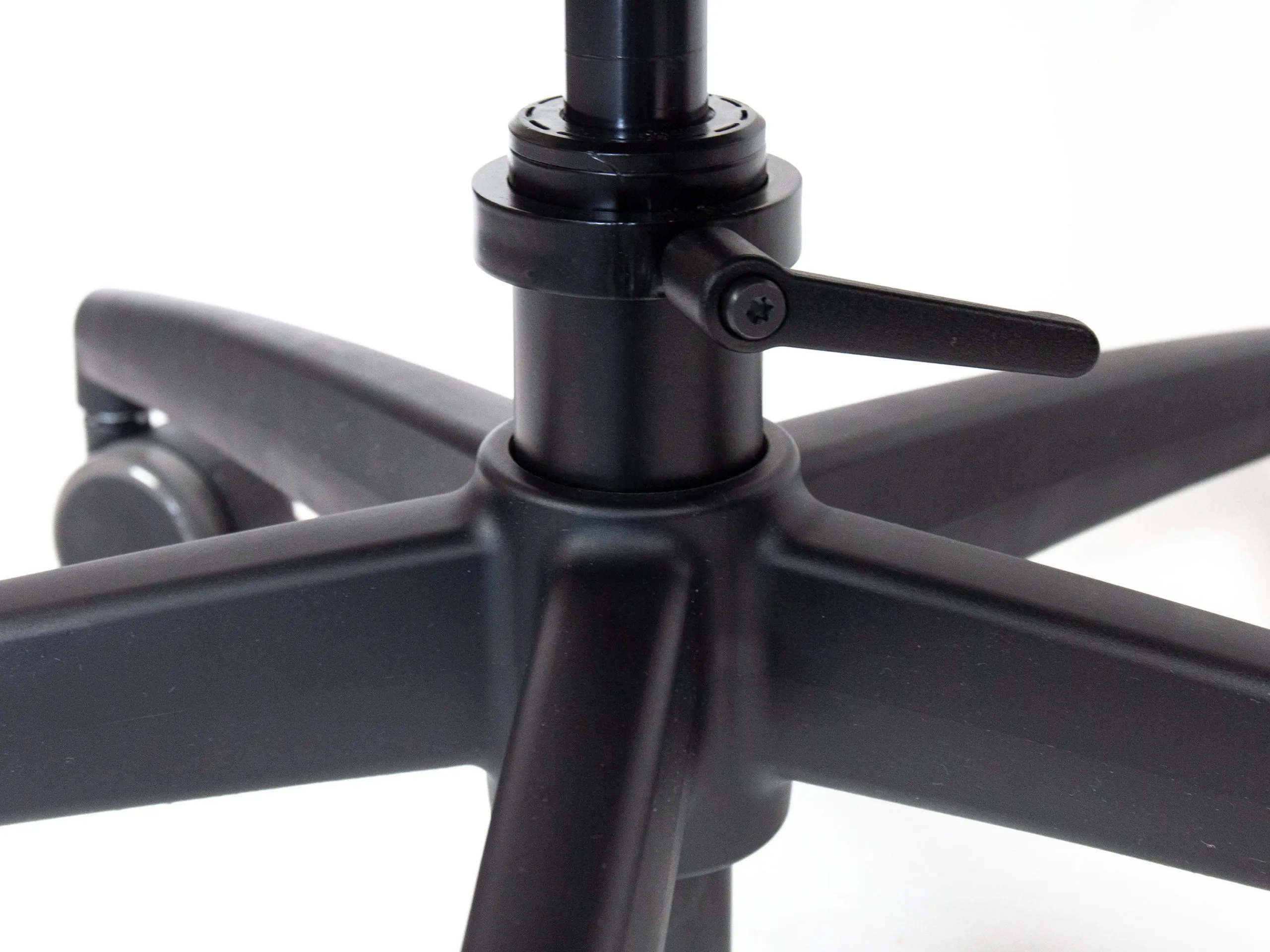 Close-up view of the MFC Caster and Rotation Brake system on the flight gaming chair