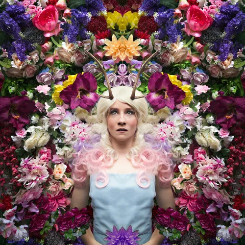 Conceptual photograph titled "Deer Petal" by Hayley Roberts, featuring a figure adorned with natural elements.