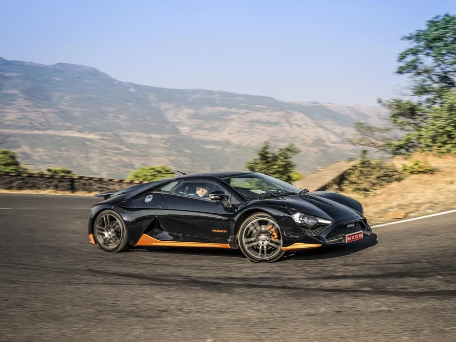 DC Avanti tackling rough roads with engine cover louvres visible