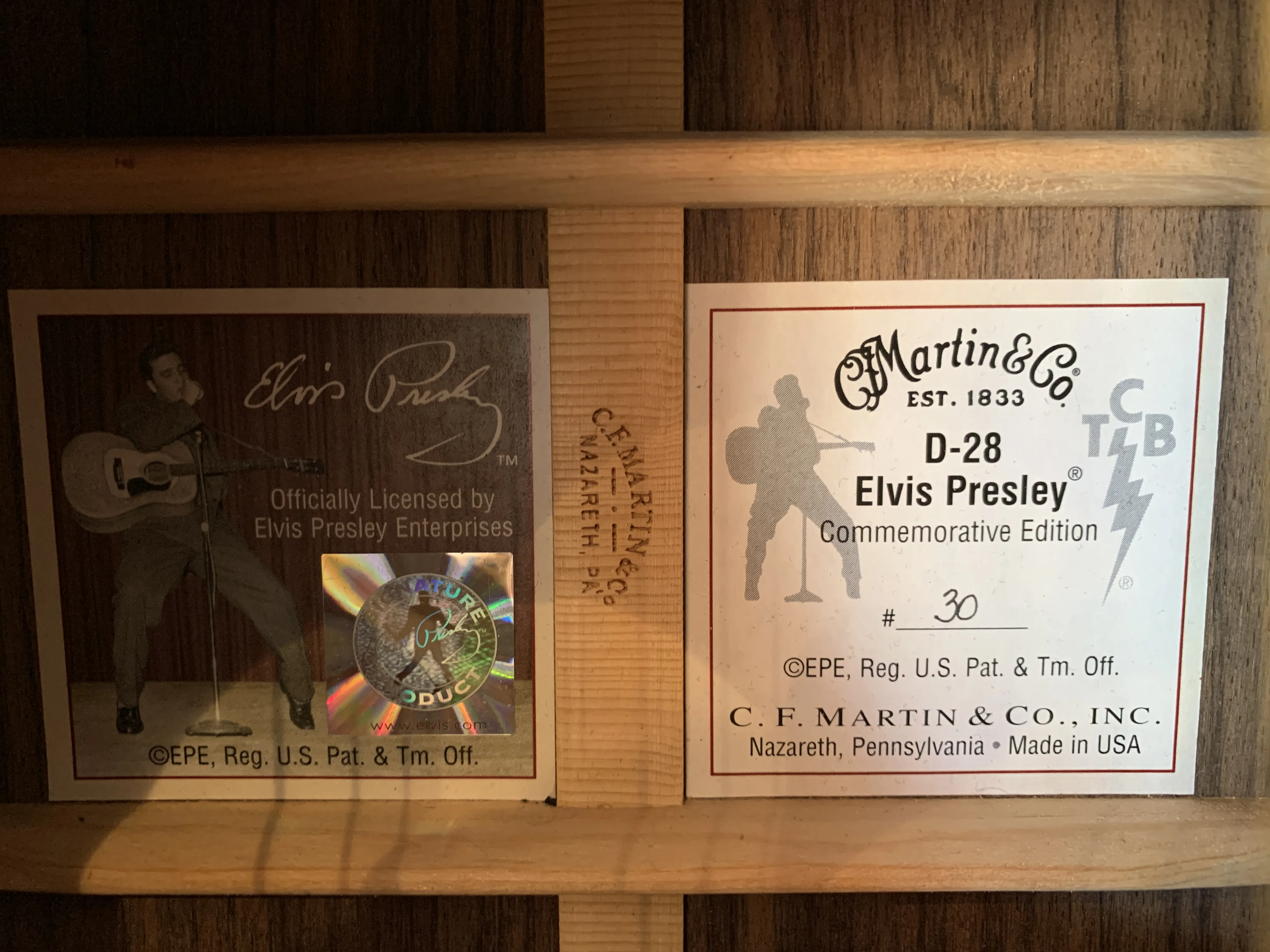 Detailed view of the abalone star inlays and solid black ebony fretboard on the Martin D-28 Elvis Presley guitar