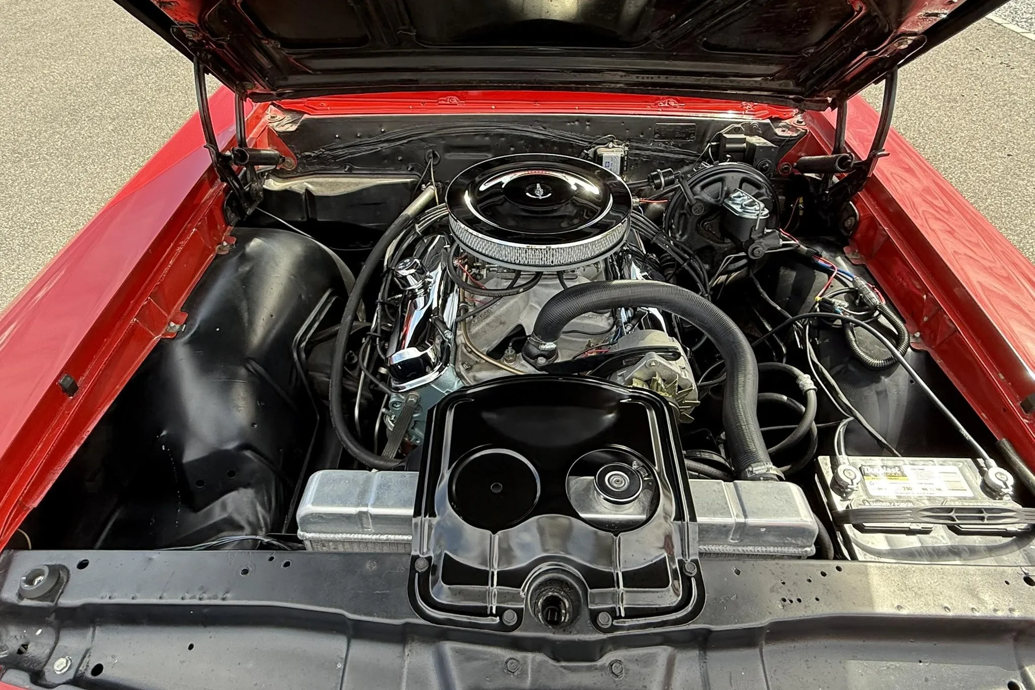 Detailed view of the rebuilt 400ci V8 engine with an Edelbrock carburetor and chrome accents