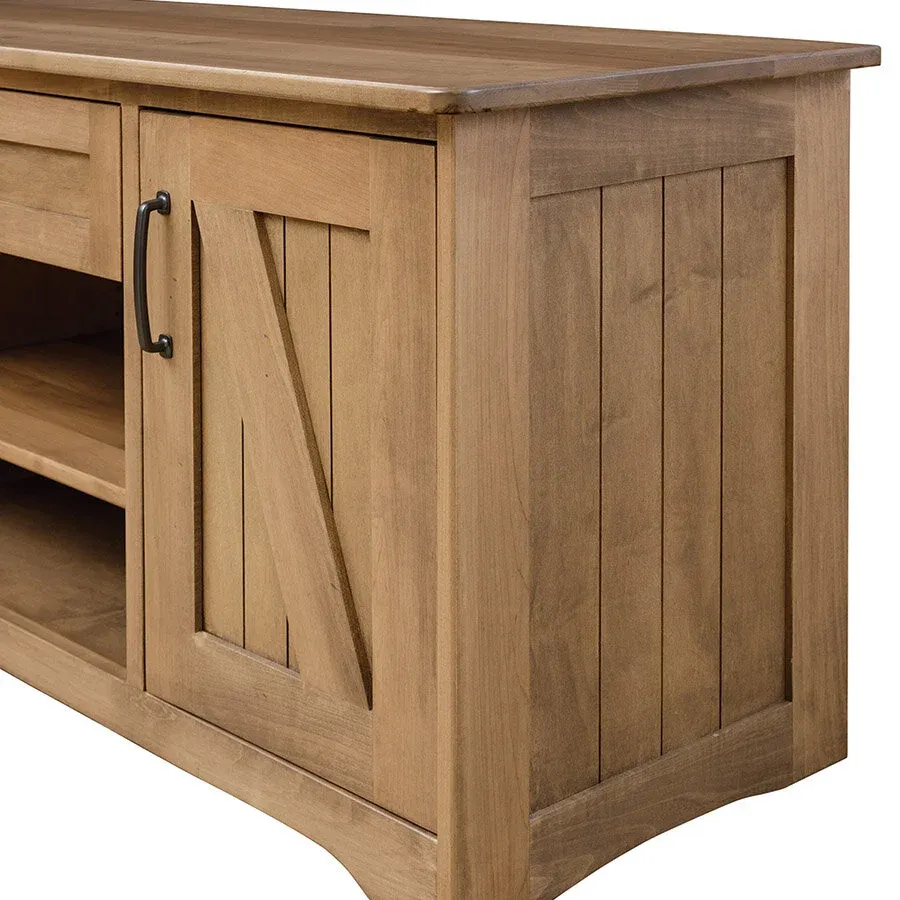 Detailed view of the side paneling on a wooden entertainment center, showcasing its craftsmanship and material.