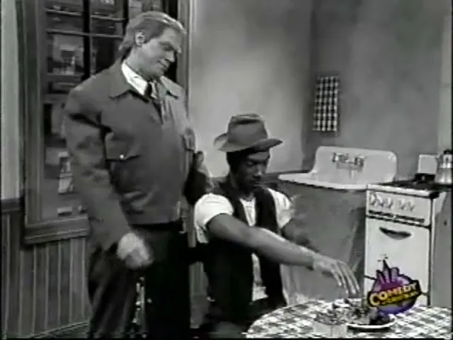 Eddie Murphy as Ed Norton in "The Honeyrooneys" sketch