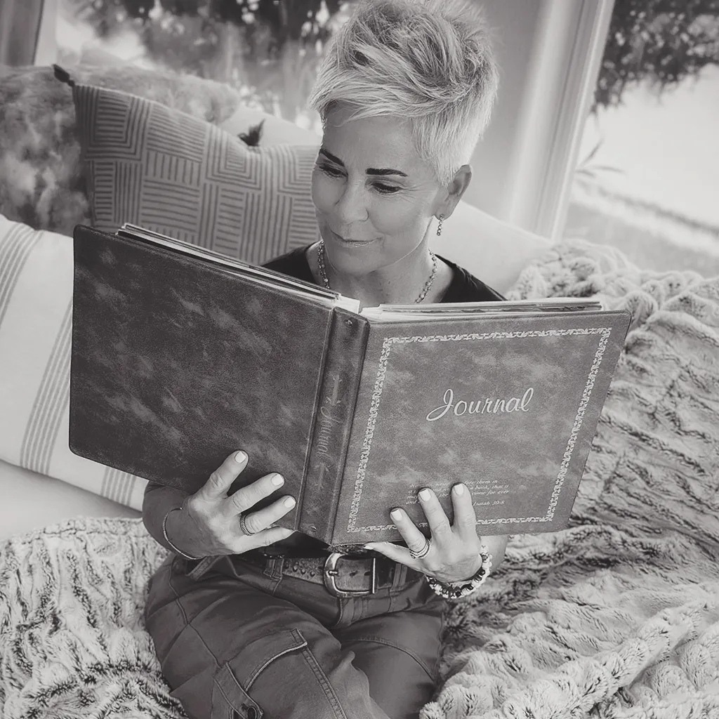 Eleanor Vance engaging in the thoughtful act of writing in her journal