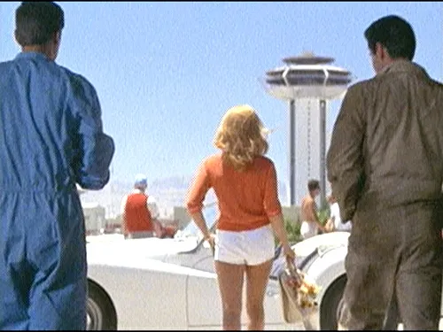 Elvis Presley as Lucky Jackson in "Viva Las Vegas" in a garage setting