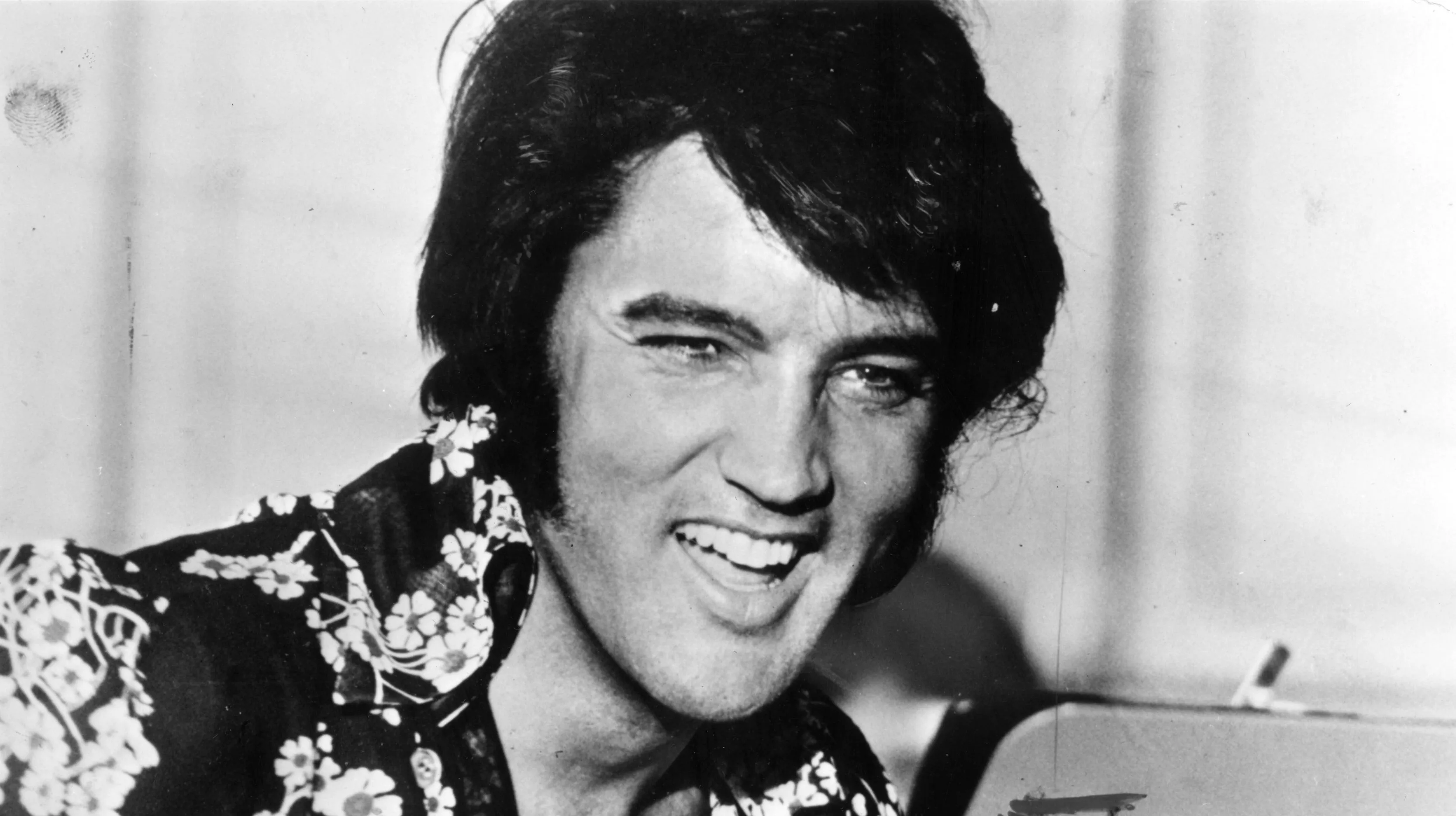 Elvis Presley in a classic pose, showing his stage presence