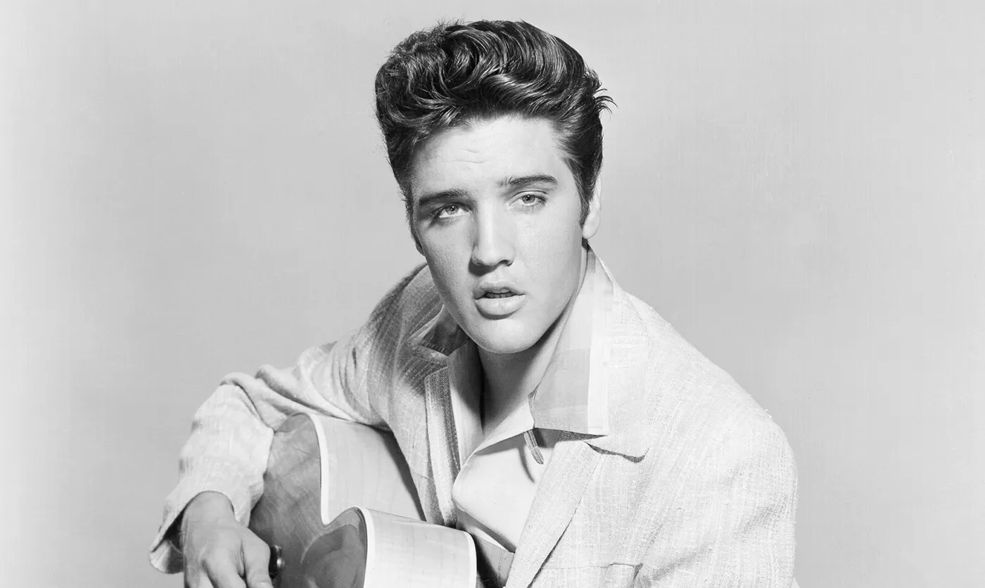 Elvis Presley in a thoughtful pose, reflecting on his music career