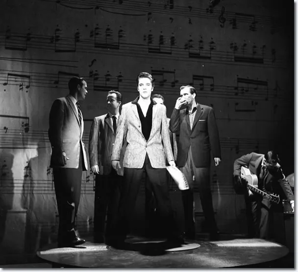 Elvis Presley performing live on stage, embodying the spirit of his gospel music