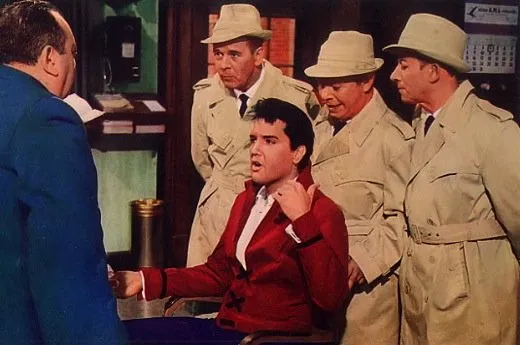 Elvis singing in "Double Trouble"